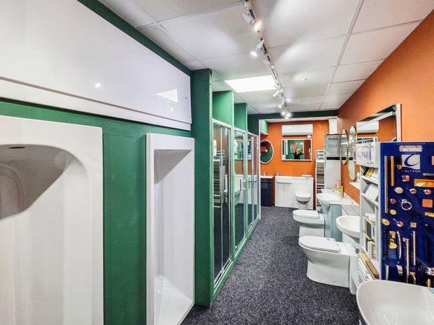 bathtubs and toilets for sale in large showroom
